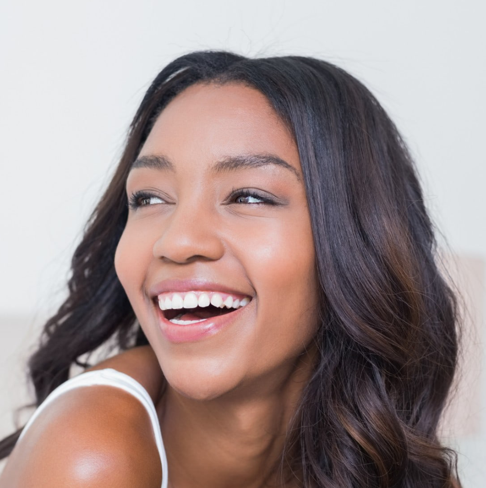 young woman smiling looking away